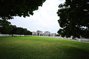 Park with canal on square Prato della Valle and Basilica Santa Giustina in Padova, Veneto, Italy.