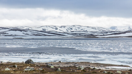 Frozen lake in the Hardangervidda mountain area in Norway