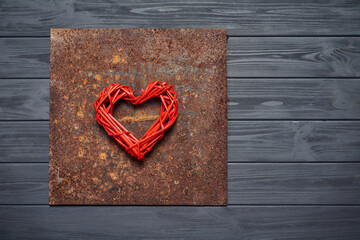 Heart shape on rough rusty metal background