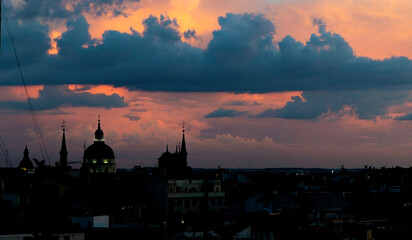 Obraz premium Skyline of Madrid, Spain, at nightfall. Old town district. Cloudy warm sky.