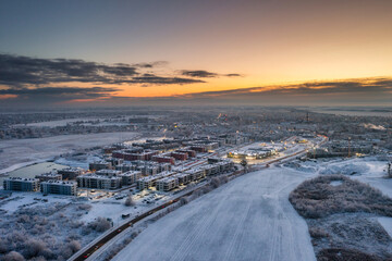 Aerial landscape of Pruszcz Gdanski covered with fresh snow at sunrise. Poland