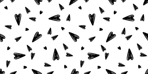 Vector seamless pattern with hand drawn balck hearts on a white background. Valentine's day design.