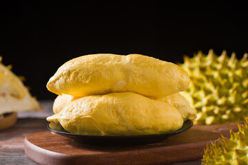Durian riped and fresh ,durian peel on wooden table.