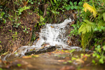 Waterfall falling down between the mountains