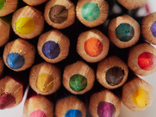 Colored pencils isolated on a white background. Close it.