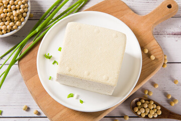 Block of fresh Tofu on wooden background