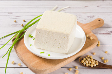 Block of fresh Tofu on wooden background