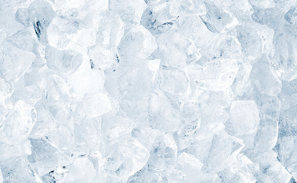 Natural crystal clear heap of crushed ice, ice cubes on the white surface background.
