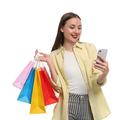 Stylish young woman with shopping bags and smartphone white background