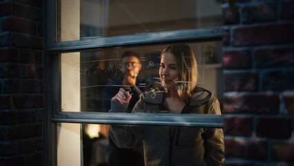 White Young Female Explaining a Math Equation on a Window at Home to a Male Friend by Using Erasable Glass Markers. Two Multiethnic Future Engineers Studying Together. University Student Life - Powered by Adobe