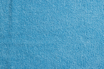 Soft blue towel as background, top view