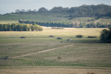 a squadron of British army FV4034 Challenger 2 ii main battle tanks in attack formation on a military combat exercise, Wiltshire UK