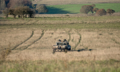 commander and gunner directing action in a British army FV4034 Challenger 2 ii main battle tank on...