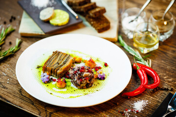 Shiitake and potatoes. Vegan. Shiitake mushroom, potato gratin, Beluga lentils, yellow beet cream. Delicious healthy traditional food closeup served for lunch in modern gourmet cuisine restaurant
