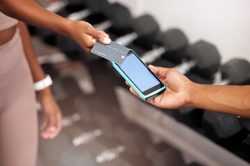 Payment, machine and woman with a credit card at the gym for a fitness contract or purchase. Card, bill and girl paying her personal trainer after training, workout or exercise at a sports center.