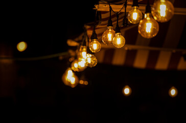 Light bulbs on street at night