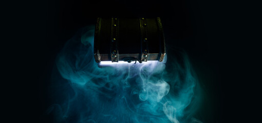 Mysterious chest on a dark background. Panoramic mockup for your logo. Horizontal banner with copy space for popular social media website cover image.