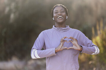 Black woman portrait, fitness and heart hand sign of a athlete showing love for nature and sports....