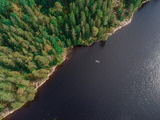 aerial footage couple Kayaking Boat tour on lake Ragnerudssjoen in Dalsland Sweden beautiful nature...