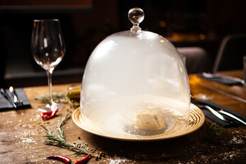 Black Angus tenderloin steak covered with 24 carat gold, potato puree, red wine sauce with berries, rosmarine on a plate. Delicious healthy food served for lunch in modern gourmet cuisine restaurant