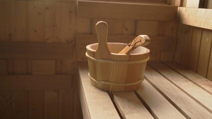 Fototapeta na wymiar Wooden sauna bucket in finnish sauna, accessory.