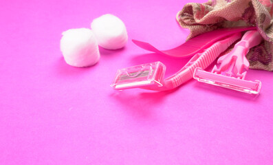 New pink disposable razors for safe shaving of female skin.Razor for smooth shaving. Sharp razors for personal hygienic routine. selective focus.