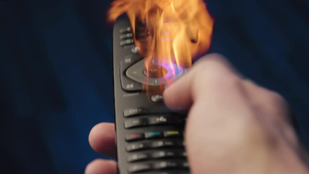 A man using a tv remote console