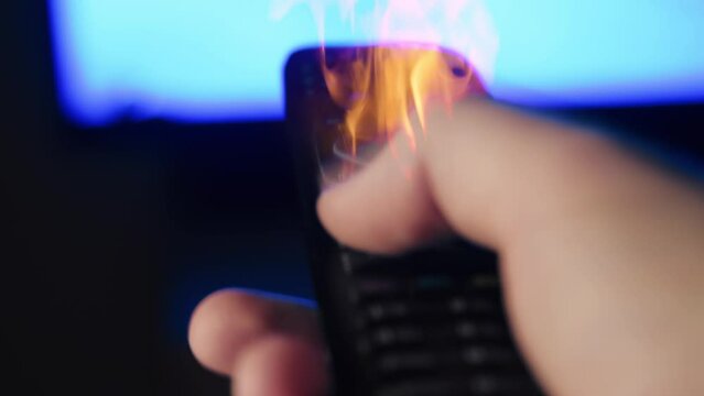 A man using a tv remote console