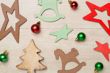 Wooden Christmas toys on wooden background, top view