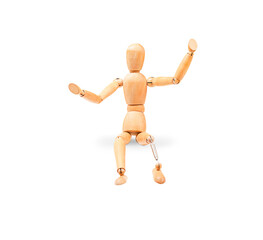 a wooden mannequin sits with legs dangling with a prosthesis on a transparent background