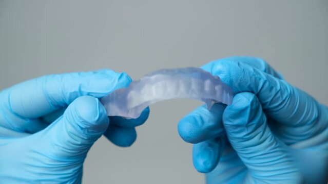 Dental transparent plastic mouthguard, splint for the treatment of dysfunction of the temporomandibular joints, bruxism, malocclusion, to relax the muscles of the jaw.