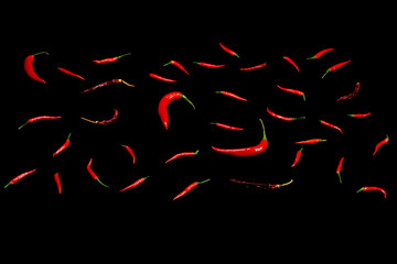 Fototapeta na wymiar Red chili peppers on a black background.