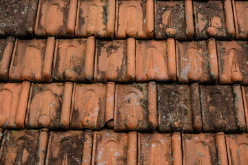 Orange house tile. Tile made of clay neatly arranged. Red clay tiled roof
