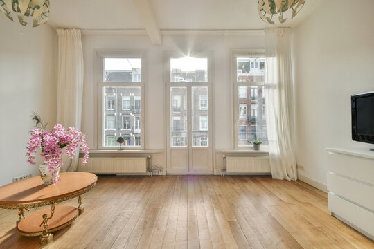 Living room with armchair and coffee table in apartment