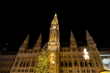 Vienna City Hall and its Christmas tree at night. Christmas decorations and lights of the city of...