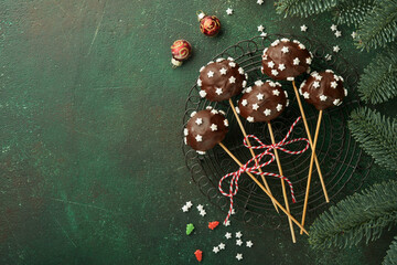 Marry Christmas sweet cake pops. Christmas dessert round brownie cake pops with stars topping on...
