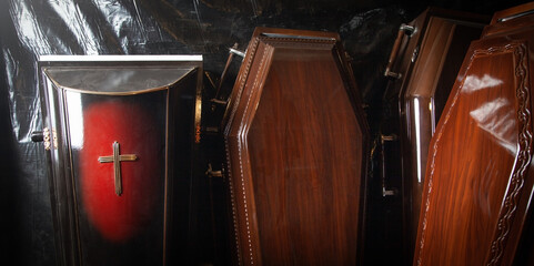 Wooden coffins at the dark room.