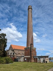 The very tall brick chimney that was attached to the coal power station built to supply the dockyards at the naval base at Cockatoo Island, Sydney, australia.