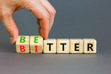 Better or bitter symbol. Concept word Better and Bitter on wooden cubes. Businessman hand....