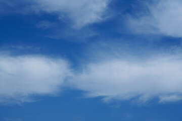 dramatic white clouds in blue sky