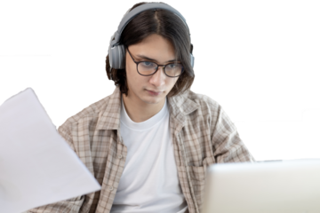 Male student is doing homework given by the teacher through the laptop's live performance system, My homework, Using laptops and data graphs in class, Online communication, Social distancing.