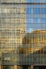 Obraz premium Modern office skyscrapers reflected in windows