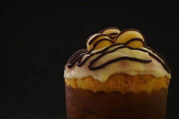 Homemade Christmas panettone made with fruit, chocolate or other fillings, can be covered, a culinary resource for the Christmas season, served alongside decorations with Santa Claus and donuts, 