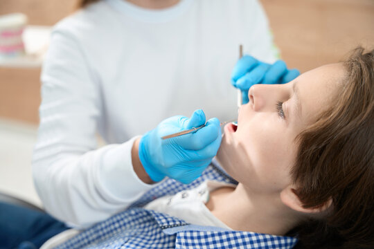 Child is given a filling in the dental office