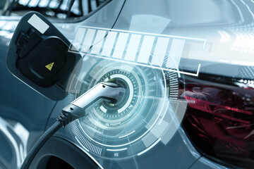 Close up of electric car inlet with connected charging cable and infographics