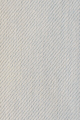 Close up shot of a white colored jeans texture background.