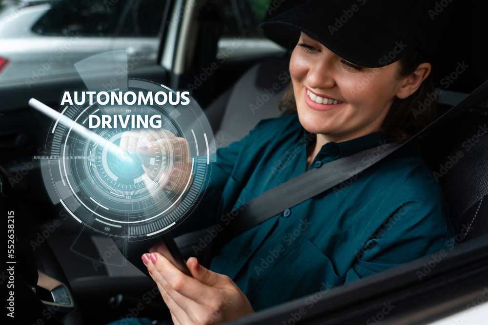 Poster woman driver controls an autonomous car using a digital tablet