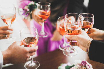 Bride and a groom with the glasses of champagne