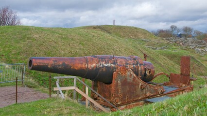 Fototapeta na wymiar Old cannons remaining in Suomenlinna Sea Fortress in Helsinki, Finland