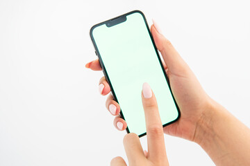 hand holding green screen phone